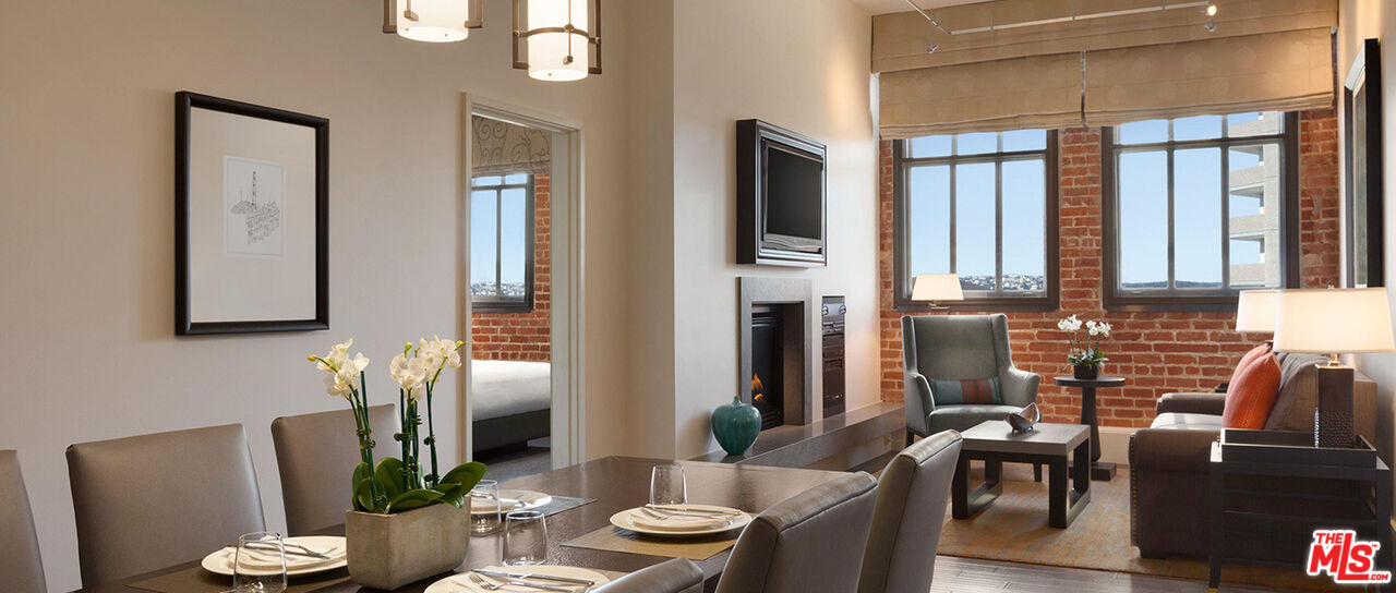 900 North Point Street, Unit 619 San Francisco, CA 94109 - Photo 5 of 12 a living room with furniture and a potted plant