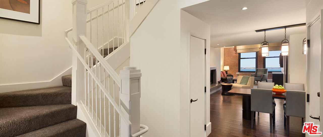 900 North Point Street, Unit 619 San Francisco, CA 94109 - Photo 6 of 12 a view of a living room with furniture and wooden floor