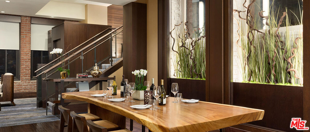 900 North Point Street, Unit 619 San Francisco, CA 94109 - Photo 9 of 12 a view of a dining room with furniture and chandelier