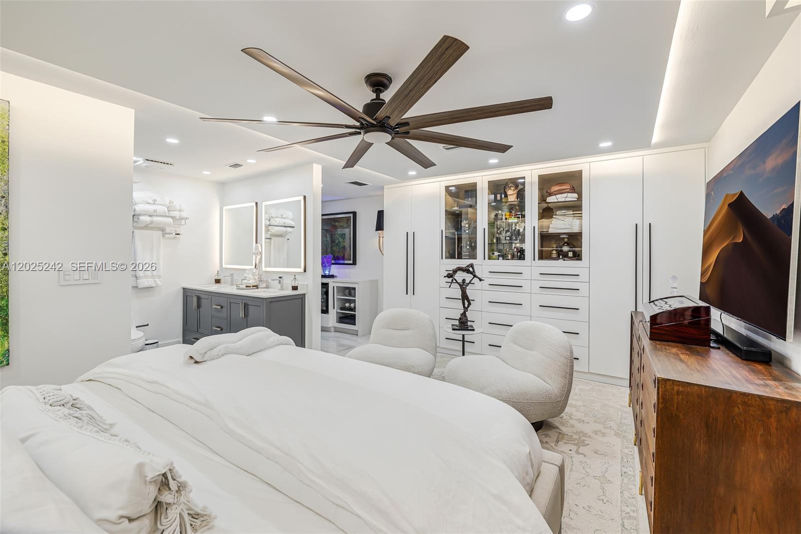 8761 Southwest 56th Street Miami, FL 33165 - Photo 48 of 90 a bedroom with a bed and a flat screen tv