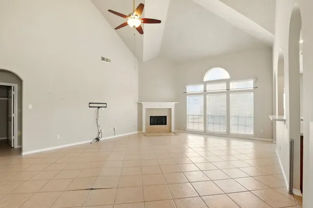 a view of an empty room with a fireplace