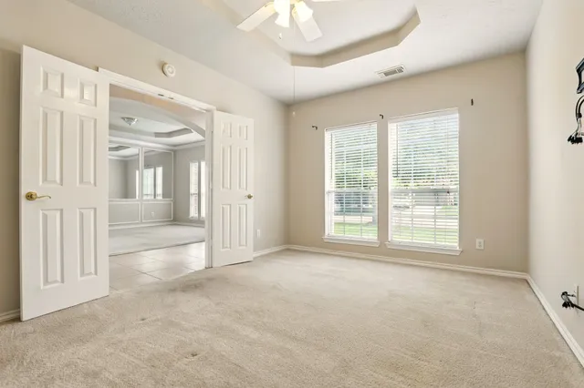 a view of an empty room with a window