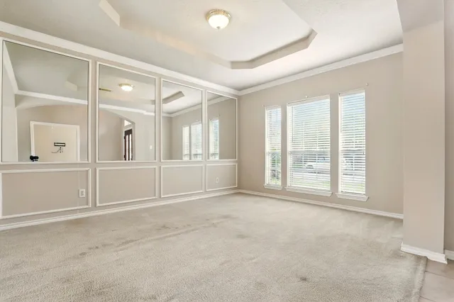 an empty room with windows and pillars in it