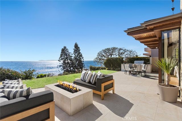 a spacious bathroom with a double vanity sink mirror and bathtub