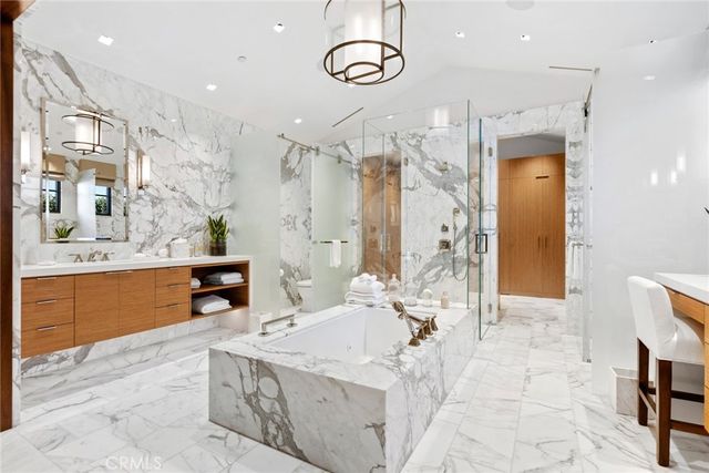 a bathroom with a tub and shower