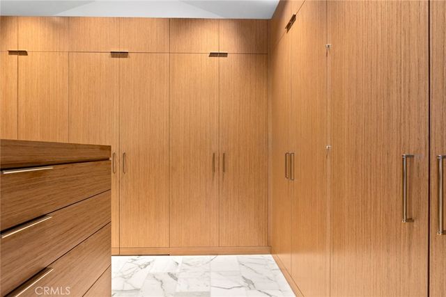 a bathroom with a sink toilet vanity and shower