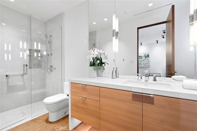a view of a swimming pool and a table and chairs under an umbrella