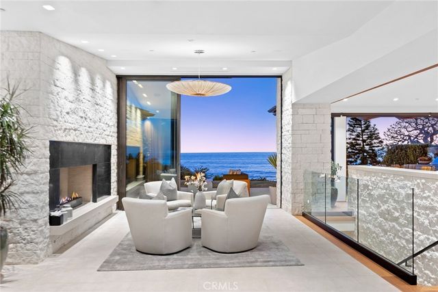 a view of a dining room with furniture and a chandelier