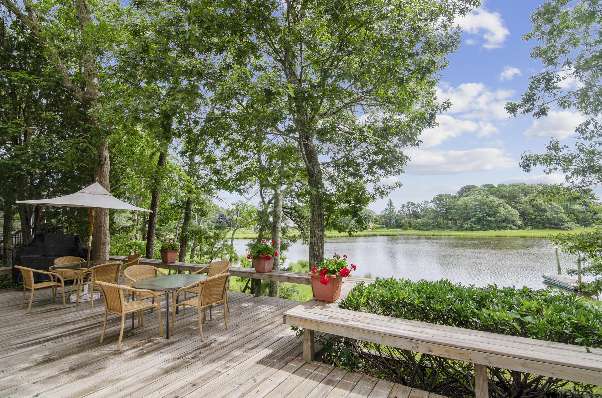 33 Fiddler Crab Lane Mashpee, MA 02649 - Photo 17 of 23 an outdoor sitting area with furniture and garden