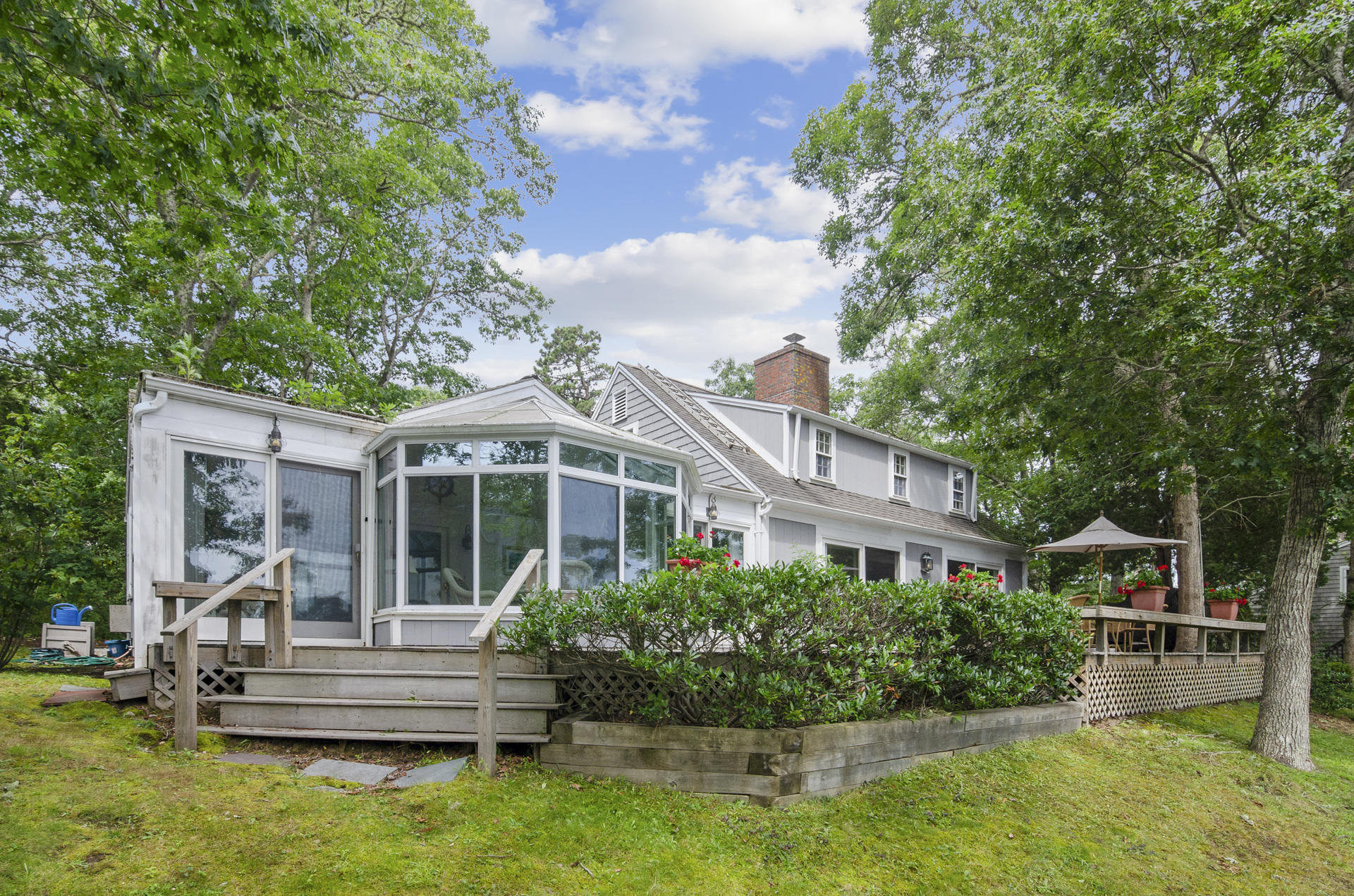 33 Fiddler Crab Lane Mashpee, MA 02649 - Photo 18 of 23 a front view of a house with a yard