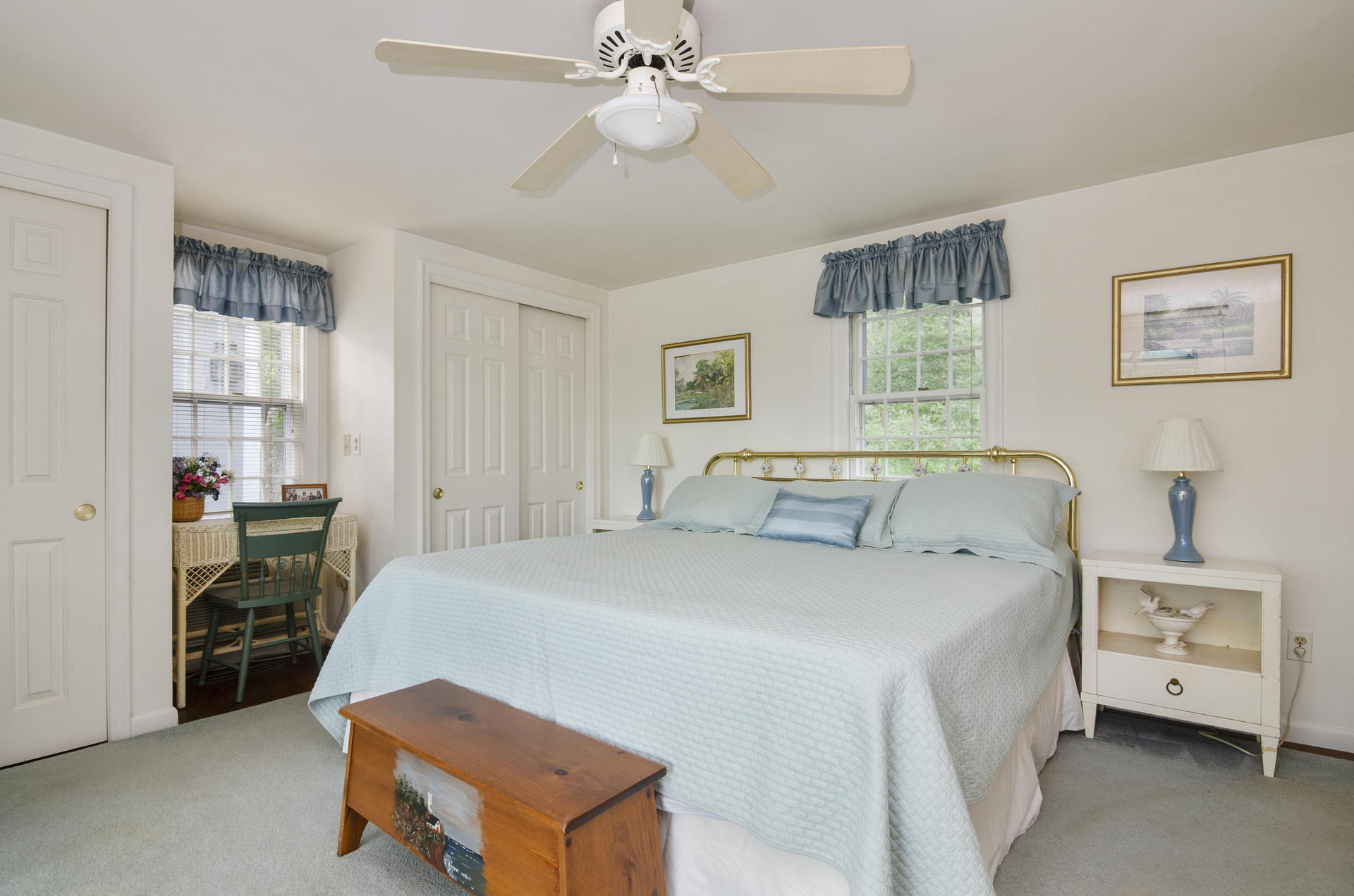 33 Fiddler Crab Lane Mashpee, MA 02649 - Photo 8 of 23 a bedroom with a bed and a chandelier