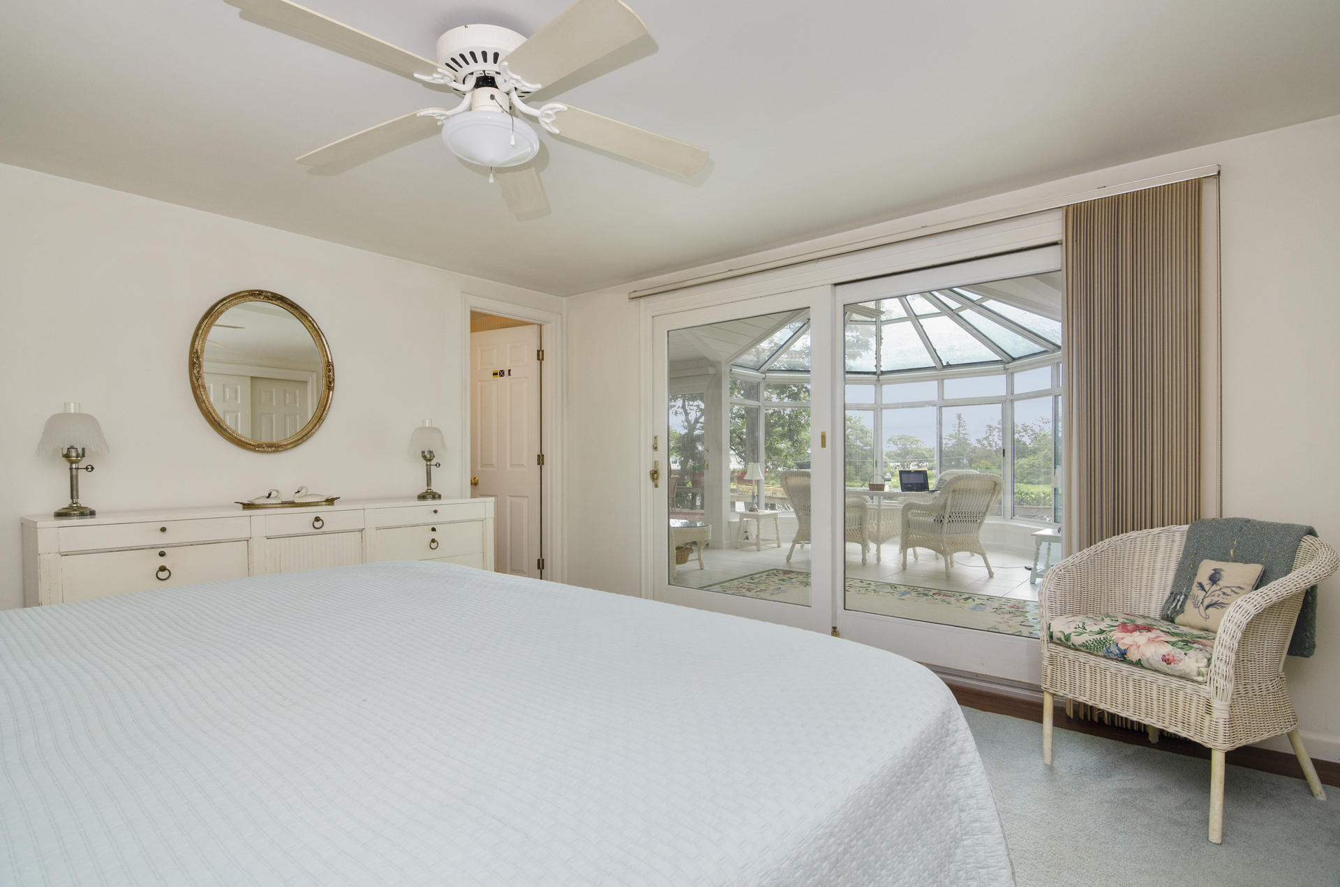 33 Fiddler Crab Lane Mashpee, MA 02649 - Photo 9 of 23 a bedroom with a bed a chandelier and a large window