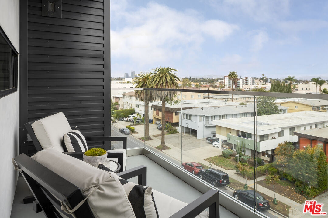 3667 Keystone Avenue, Unit 426 Los Angeles, CA 90034 - Photo 5 of 30 a view of a balcony with chairs