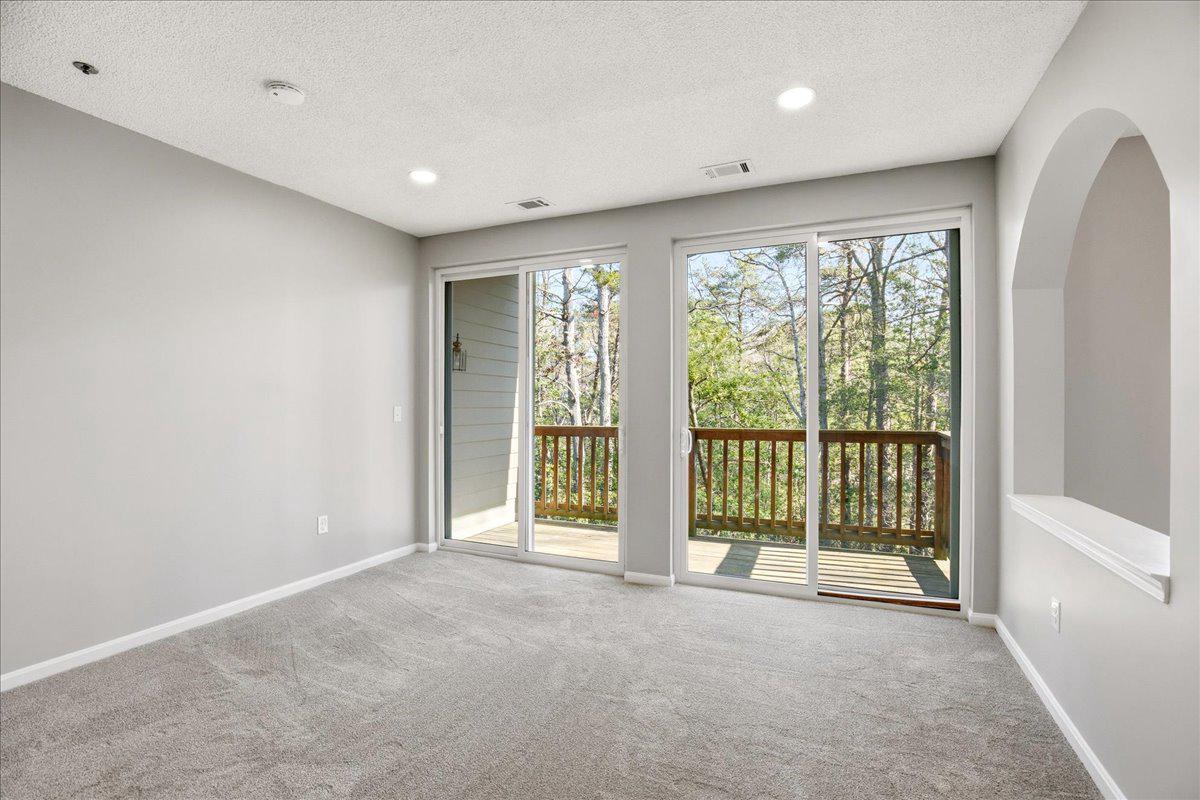 1223 Back Creek Loop, Unit 1223 Solomons, MD 20688 - Photo 9 of 44 a view of an empty room with glass door