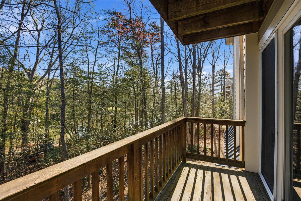 1223 Back Creek Loop, Unit 1223 Solomons, MD 20688 - Photo 10 of 44 a view of balcony with wooden floor and fence