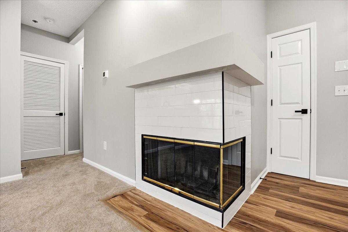 1223 Back Creek Loop, Unit 1223 Solomons, MD 20688 - Photo 11 of 44 a living room with a fireplace