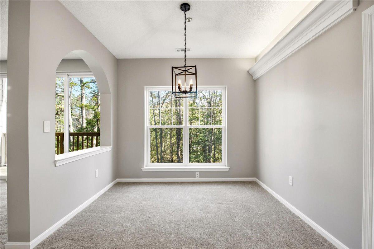 1223 Back Creek Loop, Unit 1223 Solomons, MD 20688 - Photo 14 of 44 an empty room with windows and outdoor view