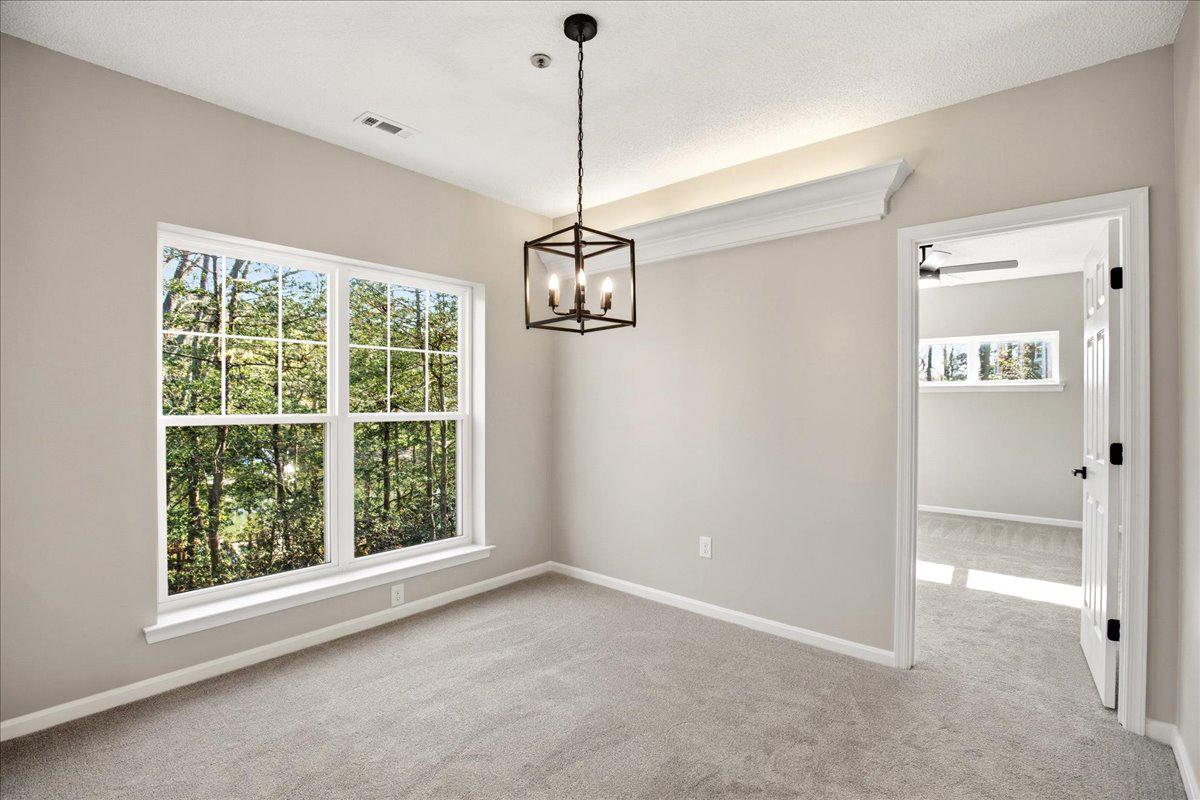 1223 Back Creek Loop, Unit 1223 Solomons, MD 20688 - Photo 20 of 44 a view of a room with a windows and ceiling fan