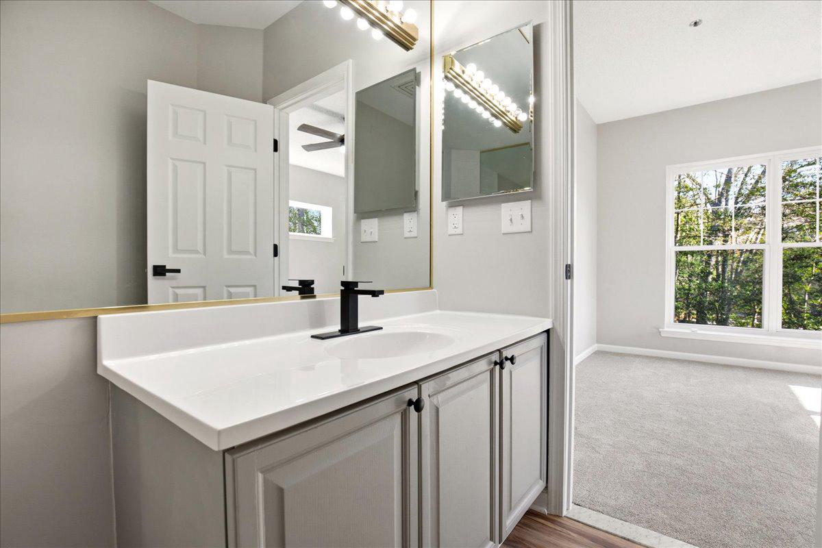 1223 Back Creek Loop, Unit 1223 Solomons, MD 20688 - Photo 24 of 44 a bathroom with a sink and a mirror