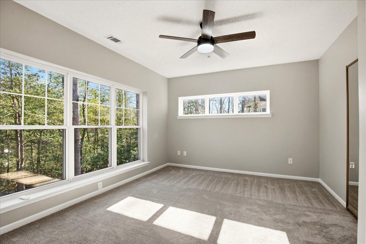1223 Back Creek Loop, Unit 1223 Solomons, MD 20688 - Photo 25 of 44 a view of room with a ceiling fan and window