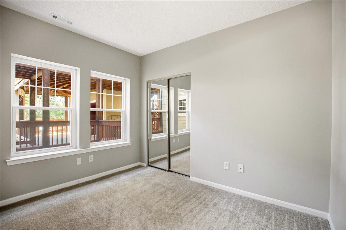 1223 Back Creek Loop, Unit 1223 Solomons, MD 20688 - Photo 30 of 44 an empty room with windows