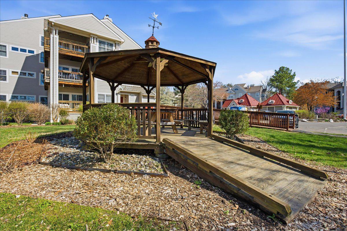 1223 Back Creek Loop, Unit 1223 Solomons, MD 20688 - Photo 33 of 44 a view of a chairs and table in the patio