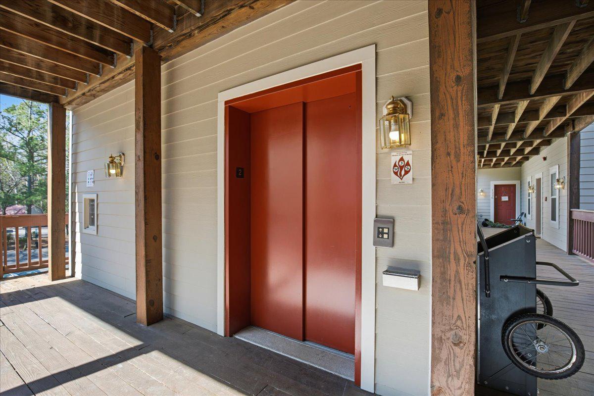 1223 Back Creek Loop, Unit 1223 Solomons, MD 20688 - Photo 8 of 44 a view of a door and chair in front of a house