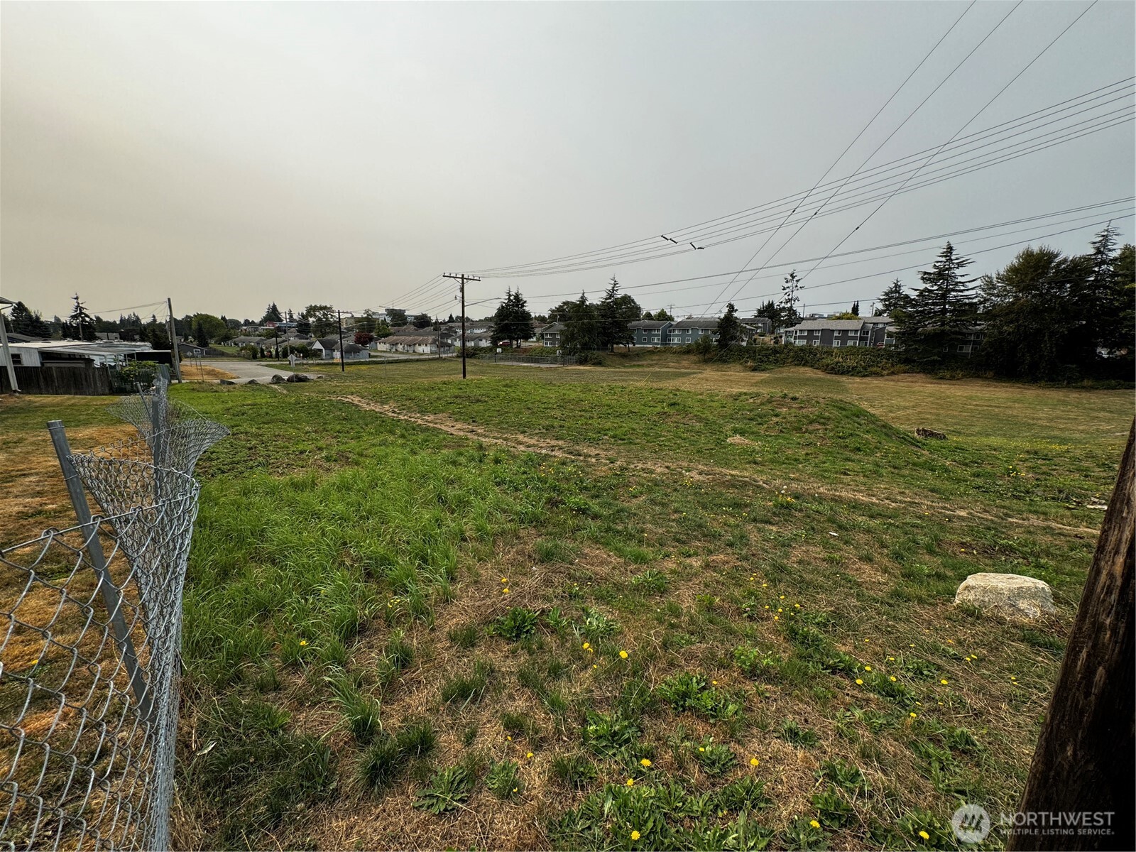 2905 11th Street, Unit AD Everett, WA 98201 - Photo 16 of 17 a view of a lake with houses