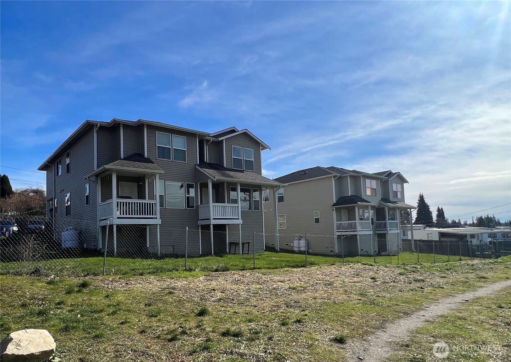 2905 11th Street, Unit AD Everett, WA 98201 - Photo 3 of 17 a front view of a house with a yard