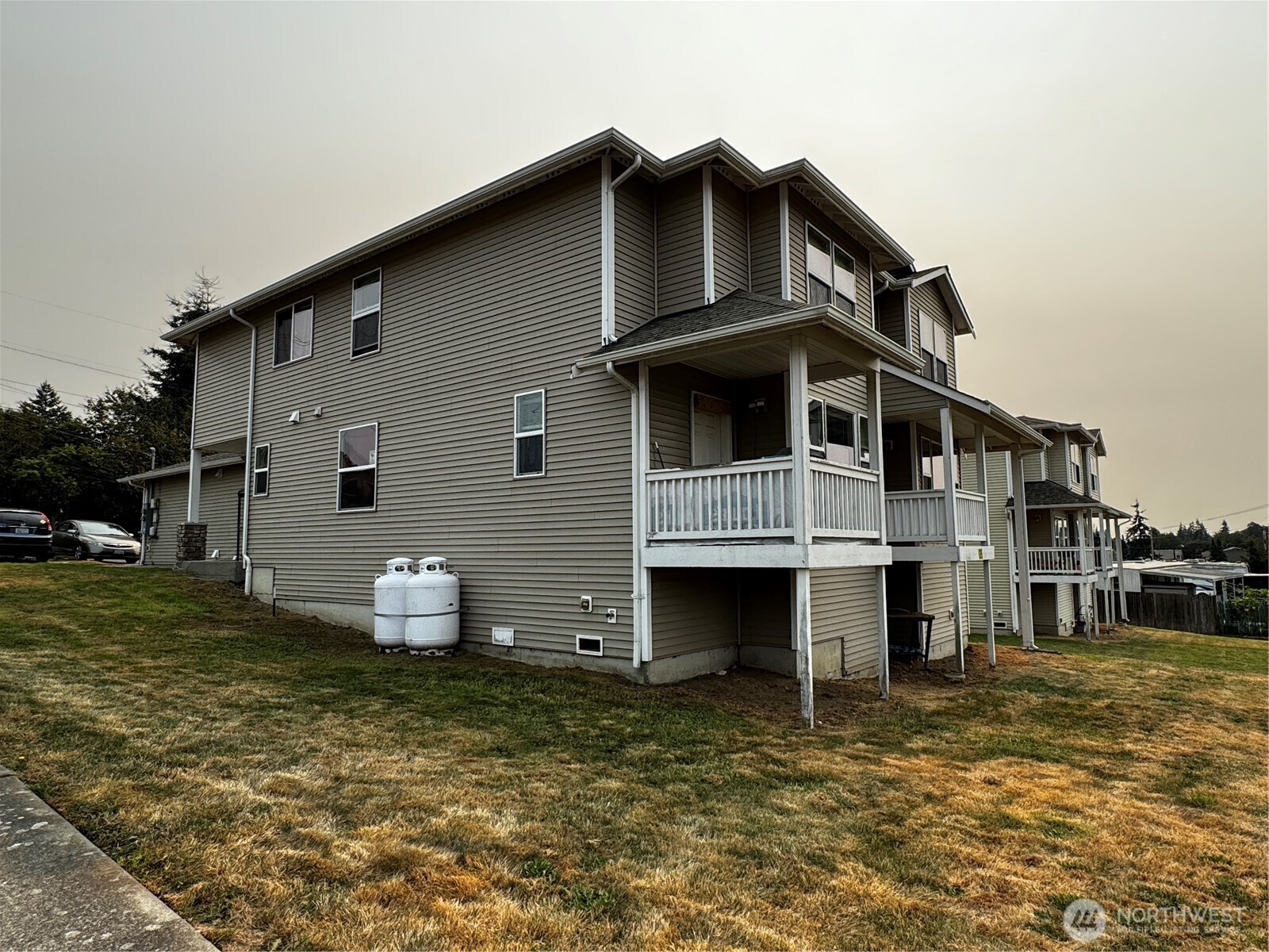 2905 11th Street, Unit AD Everett, WA 98201 - Photo 7 of 17 a view of a house with a yard