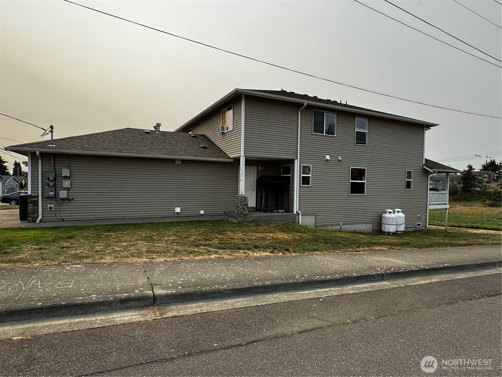 2905 11th Street, Unit AD Everett, WA 98201 - Photo 8 of 17 a view of a house with a yard