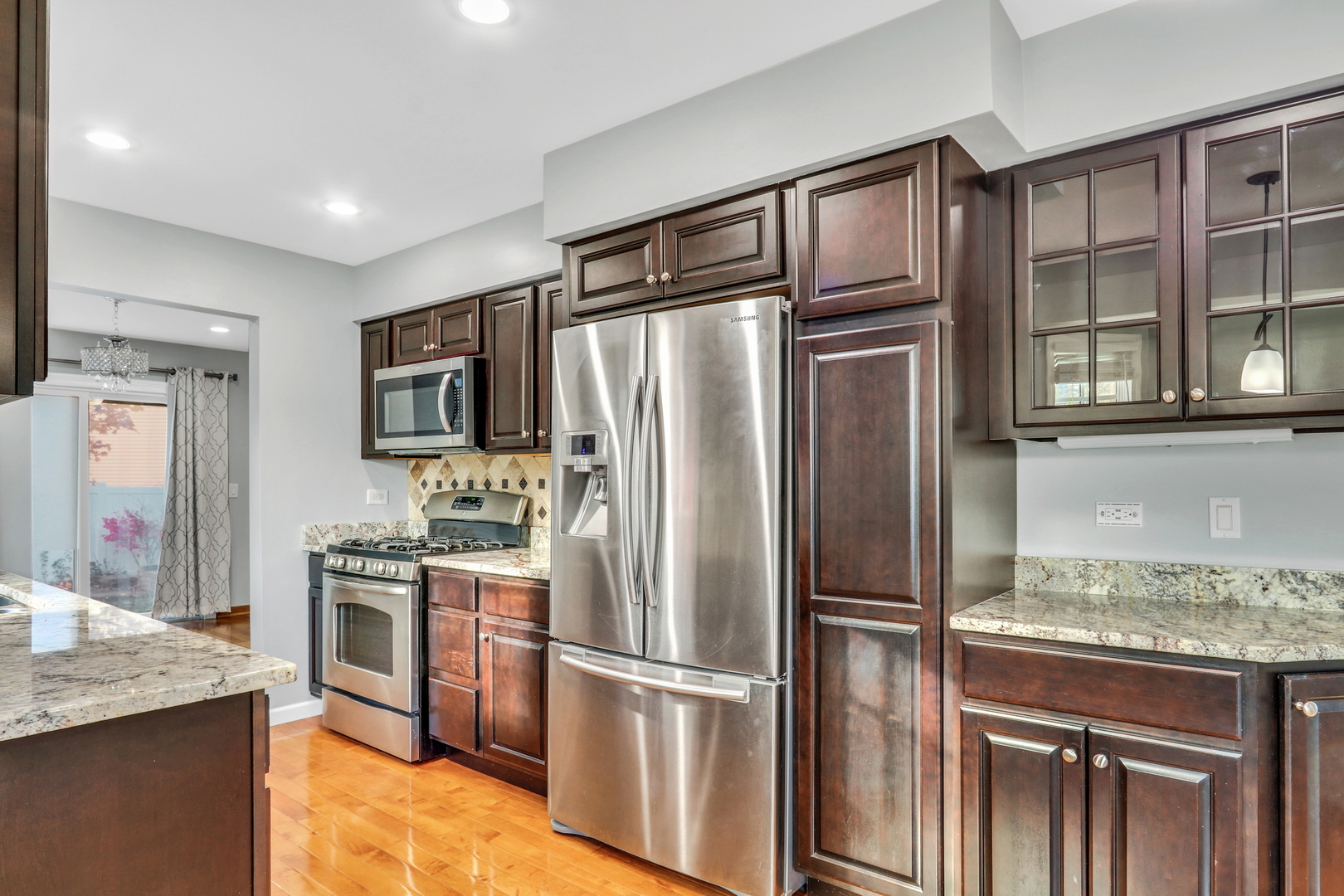 5315 Cypress Circle Gurnee, IL 60031 - Photo 5 of 31 a kitchen with stainless steel appliances granite countertop a refrigerator and a sink