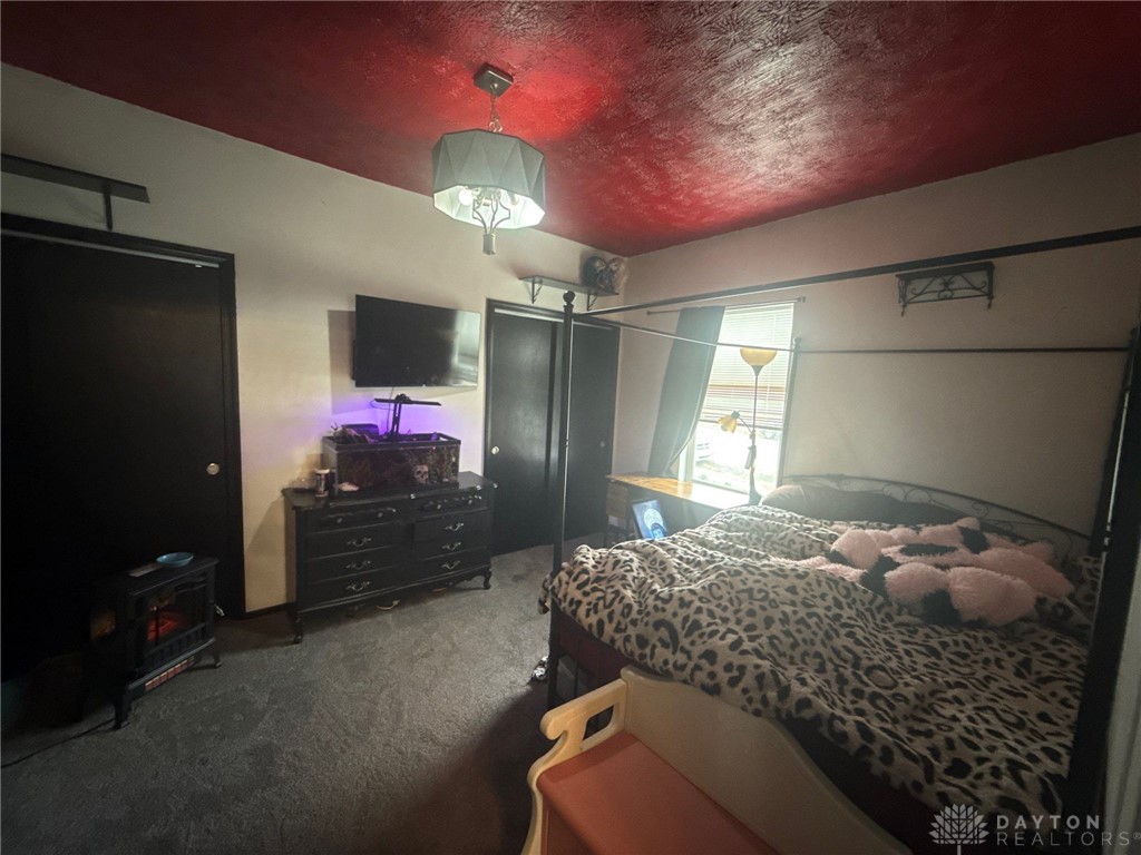 1125 West High Street Springfield, OH 45506 - Photo 26 of 39 This spacious bedroom offers a tranquil retreat with ample natural light.