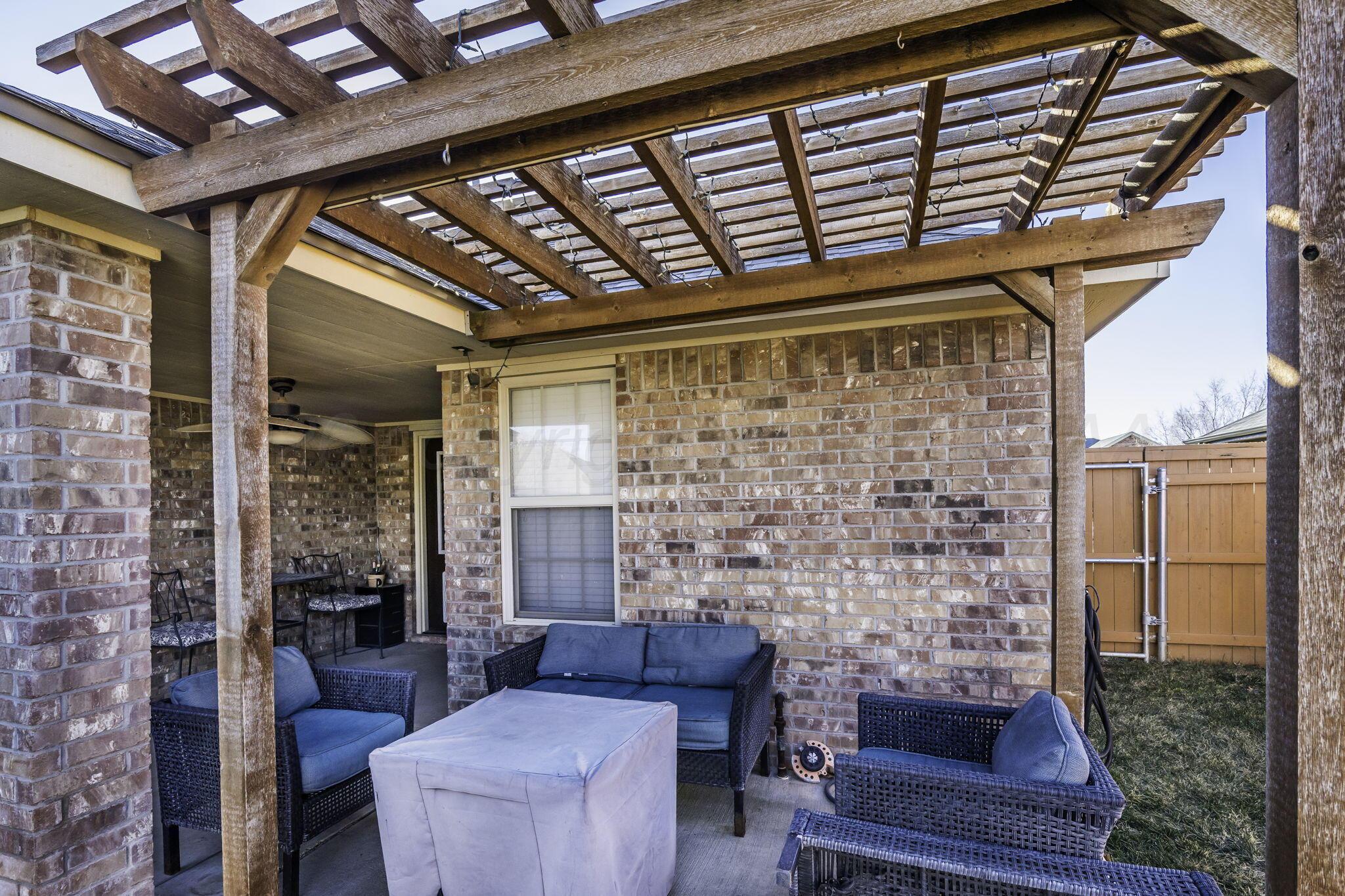 3504 Springfield Avenue Amarillo, TX 79118 - Photo 18 of 23 a outdoor living space with patio furniture and a fireplace