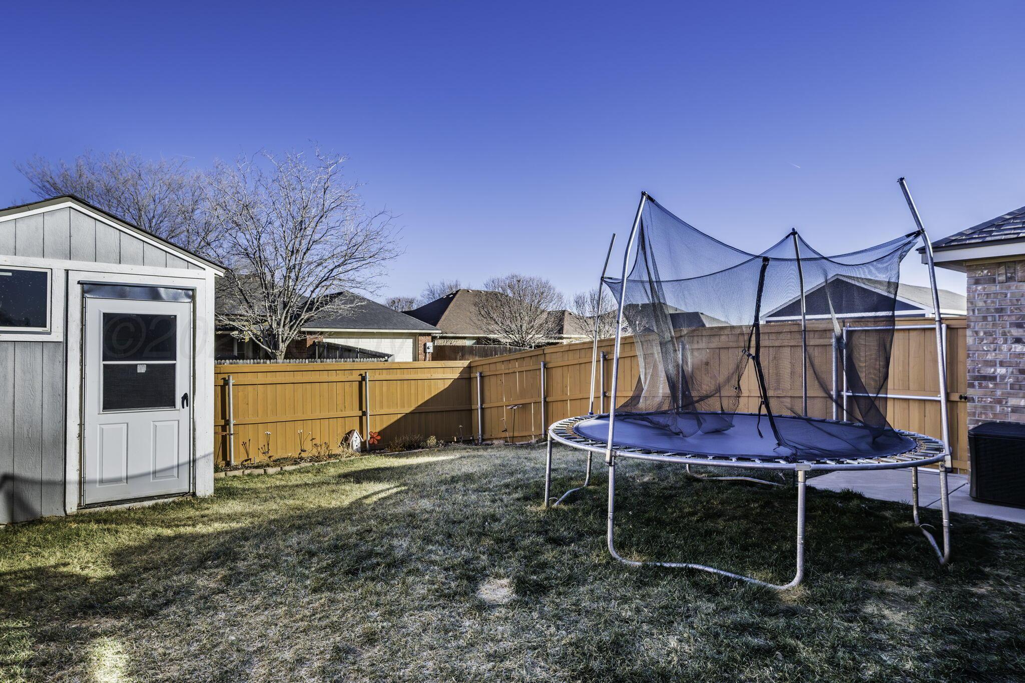 3504 Springfield Avenue Amarillo, TX 79118 - Photo 20 of 23 a backyard of a house with table and chairs