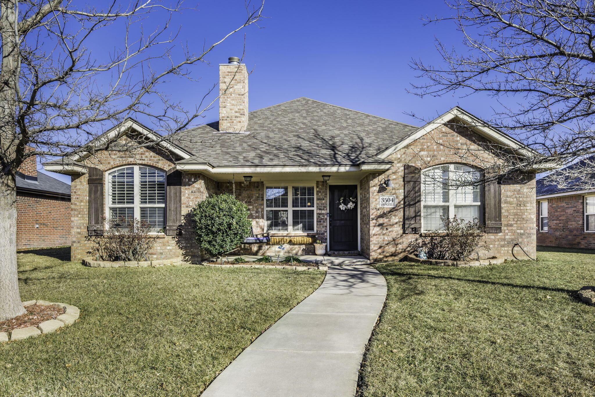 3504 Springfield Avenue Amarillo, TX 79118 - Photo 2 of 23 a front view of a house with swimming pool and glass windows