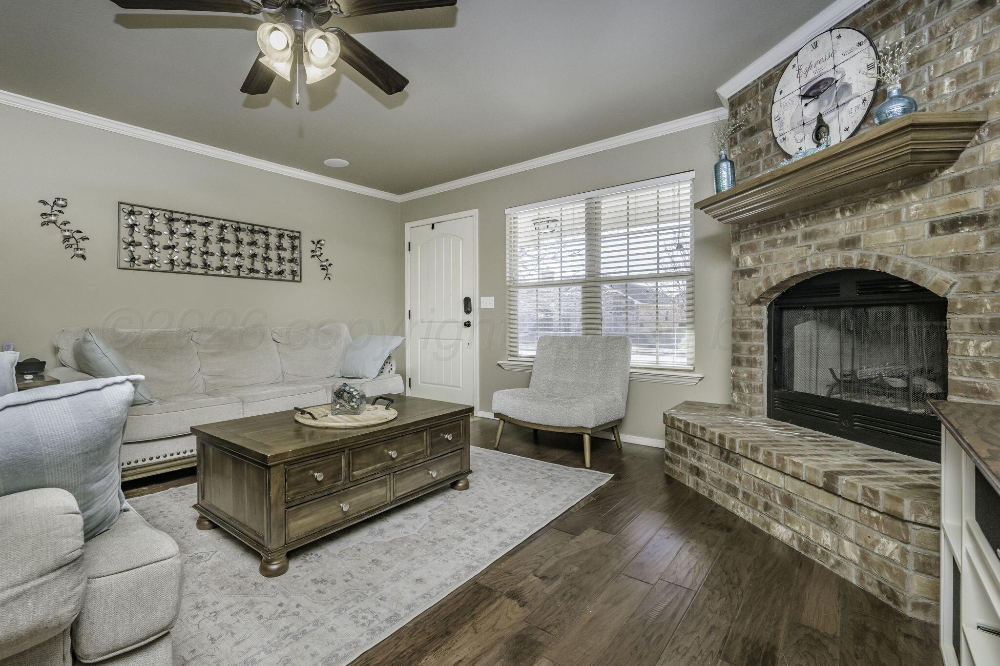 3504 Springfield Avenue Amarillo, TX 79118 - Photo 4 of 23 a living room with furniture and a fireplace