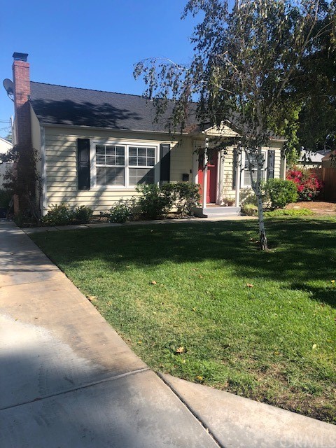 6676 Calvin Court Riverside, CA 92506 - Photo 1 of 1 a front view of a house with a garden