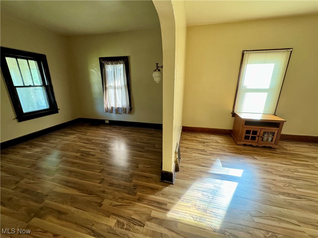 1325 Walnut Road Southeast Massillon, OH 44646 - Photo 25 of 34 Spare room with hardwood / wood-style flooring and a healthy amount of sunlight