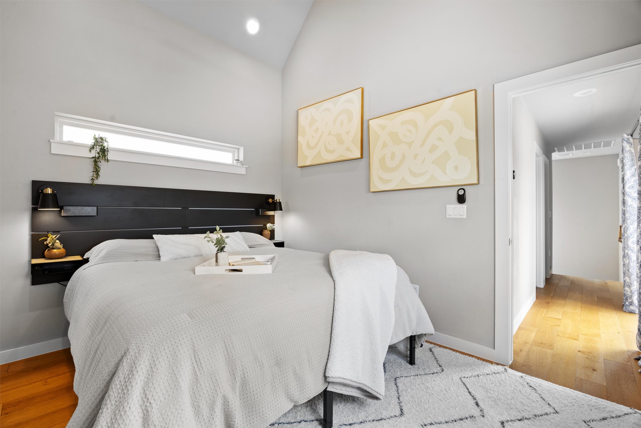1116 Stobaugh Street, Unit B Austin, TX 78757 - Photo 17 of 38 Soft natural light and simple finishes give the primary bedroom a calm, modern feel.