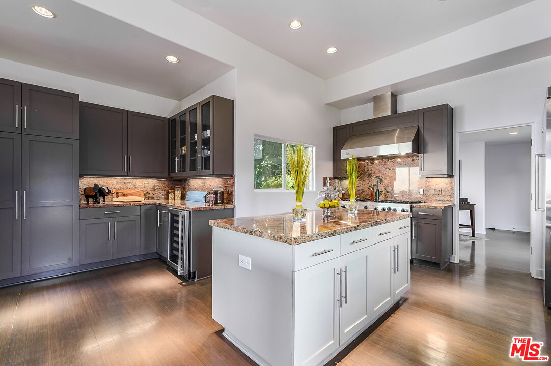 28907 Wight Road Malibu, CA 90265 - Photo 25 of 54 a kitchen with cabinets and window