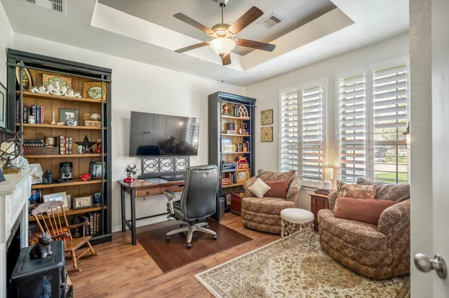 a bedroom with a bed and a fireplace