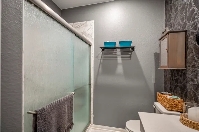 a bathroom with a sink and mirror