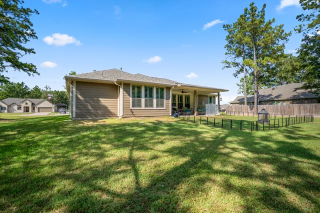 an aerial view of houses with a swimming pool
