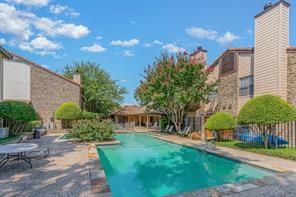 5626 Preston Oaks Road, Unit 39C Dallas, TX 75254 - Photo 15 of 38 Community pool featuring a patio