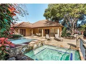 a view of a house with backyard porch and sitting area