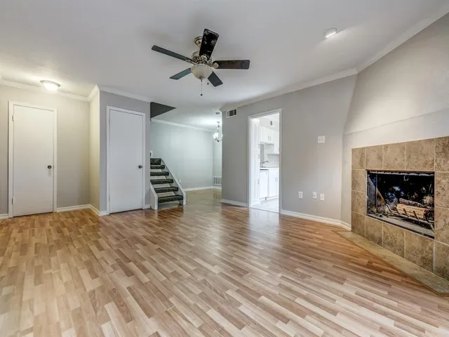 a view of an empty room and fire place