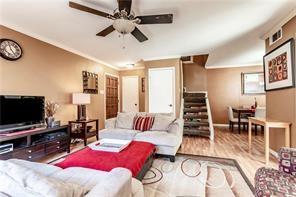 5626 Preston Oaks Road, Unit 39C Dallas, TX 75254 - Photo 27 of 38 Living area with stairs, wood finished floors, and a ceiling fan
