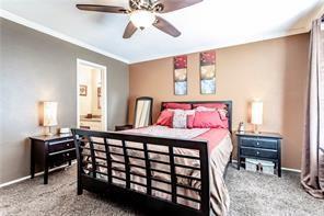 5626 Preston Oaks Road, Unit 39C Dallas, TX 75254 - Photo 38 of 38 Carpeted bedroom featuring a ceiling fan and ensuite bath