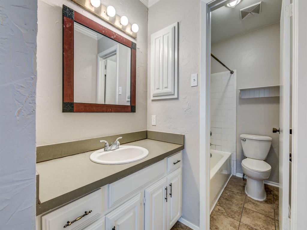 5626 Preston Oaks Road, Unit 39C Dallas, TX 75254 - Photo 8 of 38 Bathroom with a textured wall, vanity, and bathing tub / shower combination